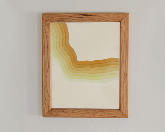 Abstract art print with various gradients of yellow in a cherry frame inspired by the crashing waves of the Atlantic coast