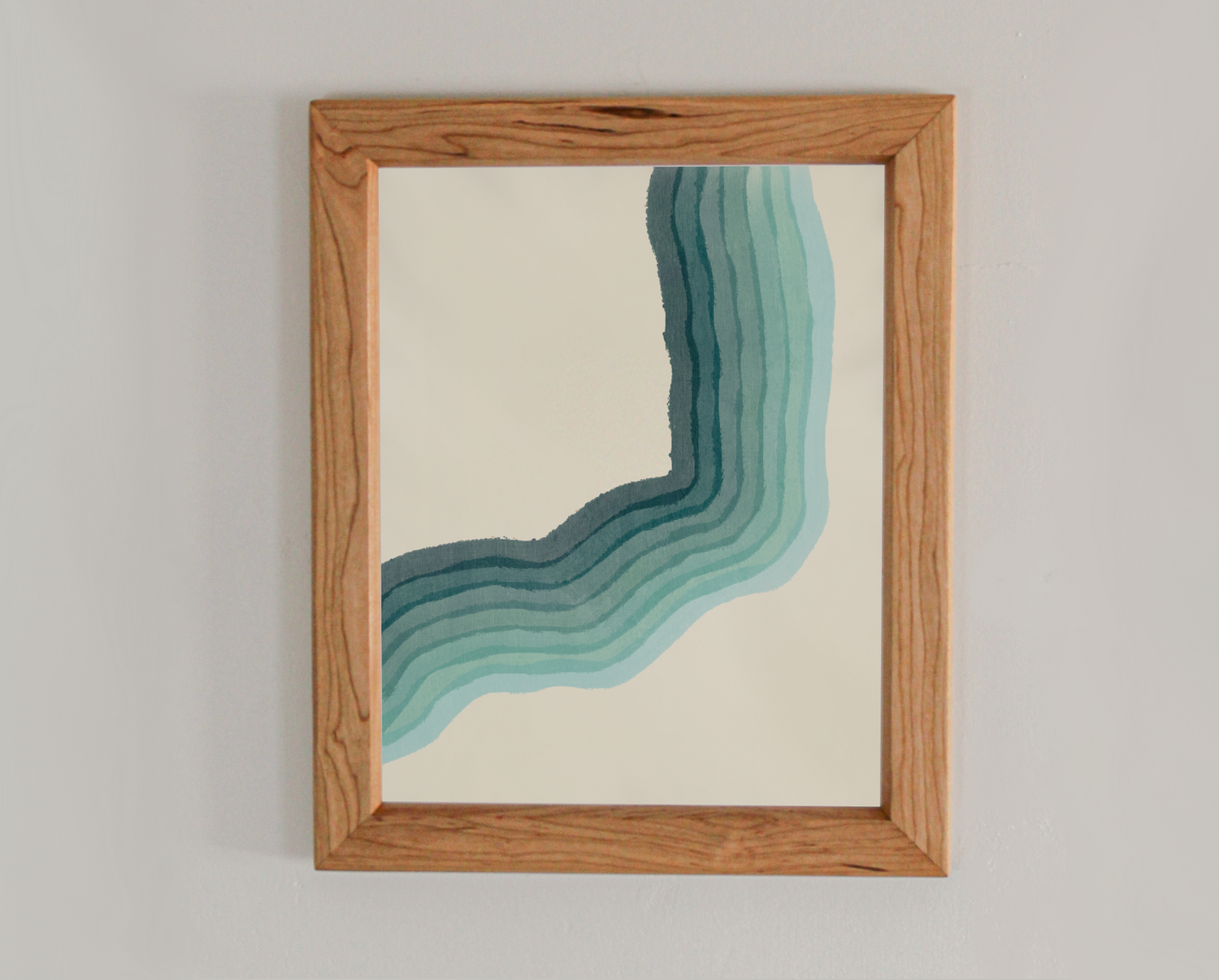Abstract art print with various gradients of blue in a cherry frame inspired by the crashing waves of the Atlantic coast