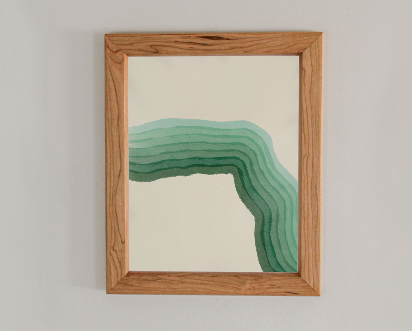 Abstract art print with various gradients of green in a cherry frame inspired by the crashing waves of the Atlantic coast