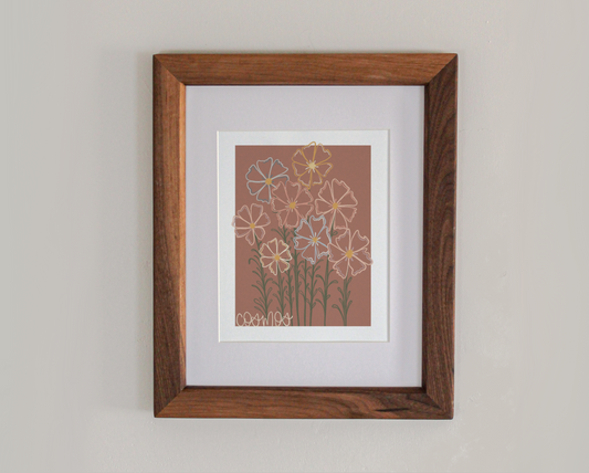 An art print line drawing of cosmos in bloom in a cherry hardwood frame 