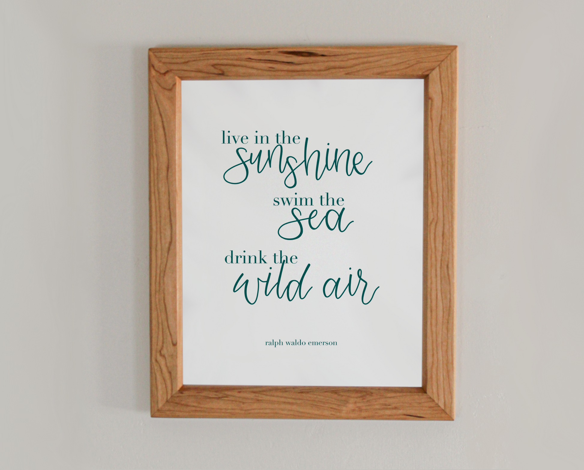 Art print of text from a Ralph Waldo Emerson in a mix of type and calligraphy; quote reads: live in the sunshine, swim in the sea, drink the wild air